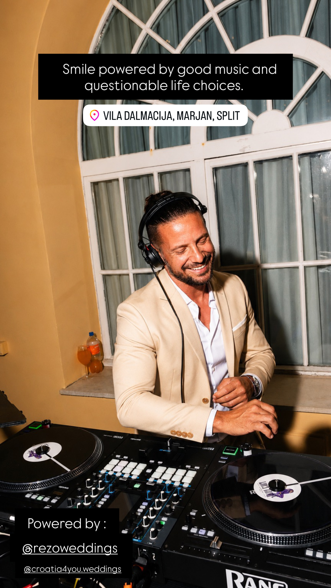 Luca mixing in a beige jacket beneath arched windows